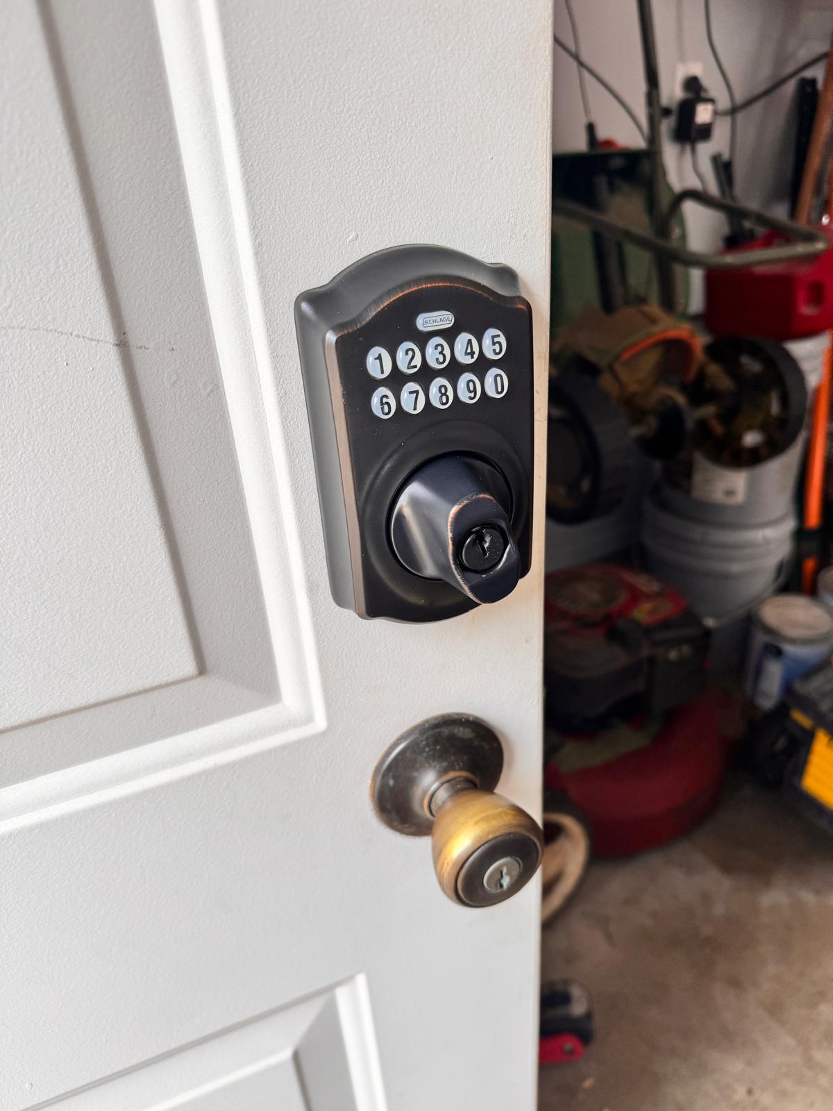 Front door of an Oklahoma City home secured with a new deadbolt after a break in repair
