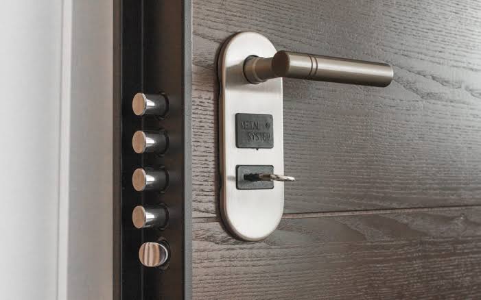 High security commercial cylinder with a restricted keyway installed on a business entrance in Oklahoma City