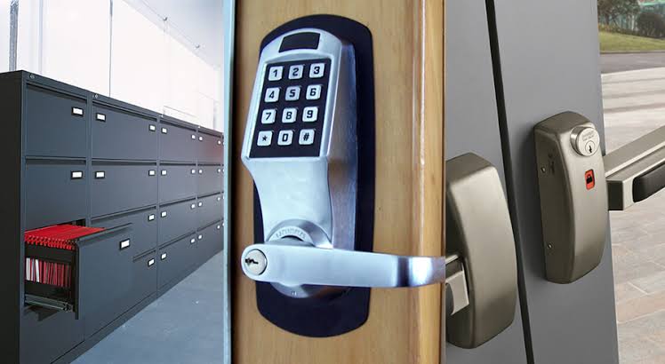 Commercial grade lever handle and cylinder being fitted to an office door in Oklahoma City